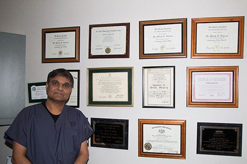 Dr. Govani with dental diplomas